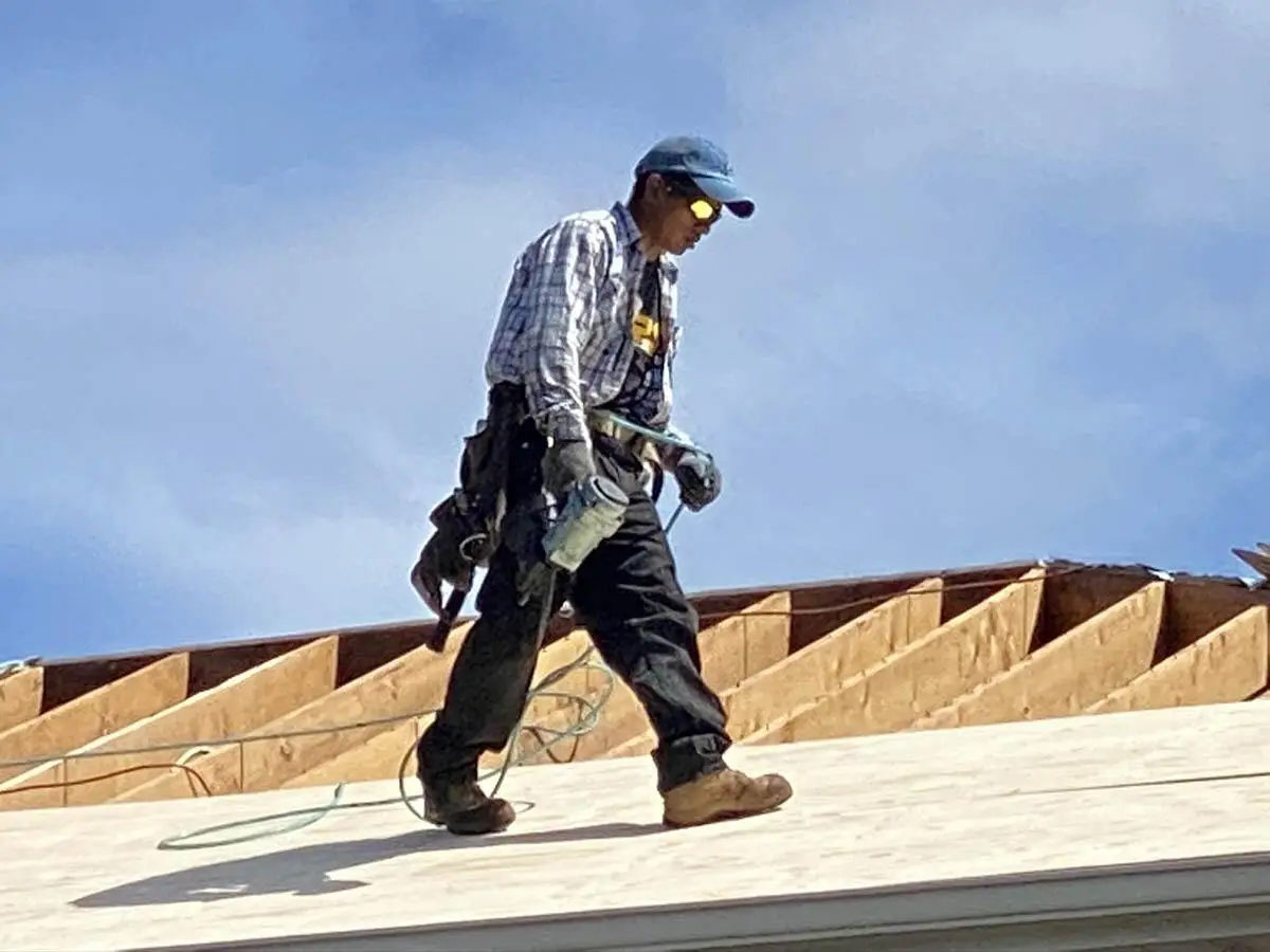 worker on roof | County Roofing Systems