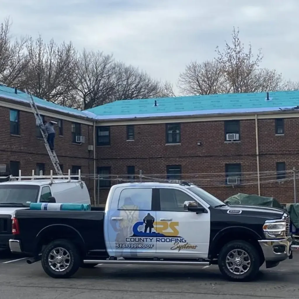 County Roofing Systems truck on site at a roof job.