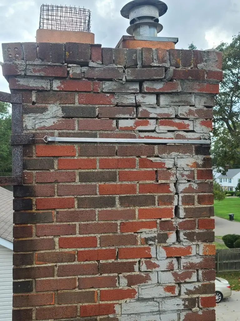 Cracked chimney masonry requires immediate attention to avoid further problems.