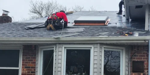 County Roofing Systems working on rainy day